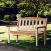 Summer Cedar A solitary cedar wooden bench basks in the tranquility of a sunlit garden during summer. summercedar.com