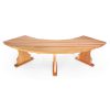 Summer Cedar An elegant Summer Cedar dining table with a unique, curved design and symmetrical base, isolated on a white background. summercedar.com