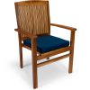 Summer Cedar A classic wooden chair with a vertical slat back design and a navy blue cushion on the seat, available at Summer Cedar. summercedar.com