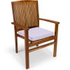 Summer Cedar Wooden chair with vertical slat back and a light-colored cushion on a Summer Cedar background. summercedar.com